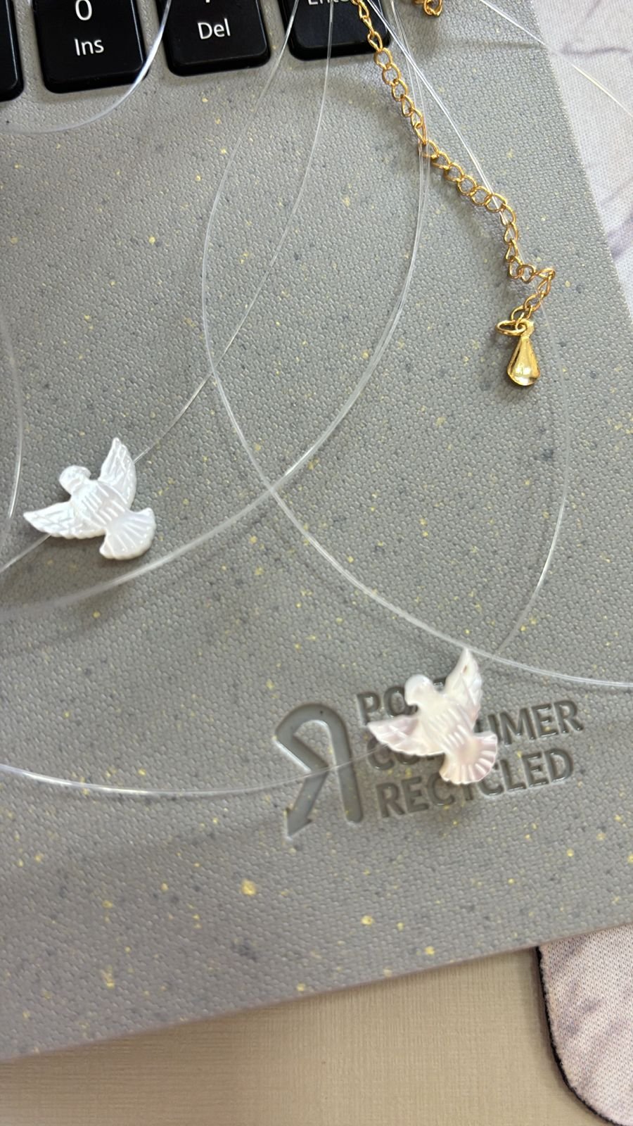 C.O fio de nylon madre perola espirito santo