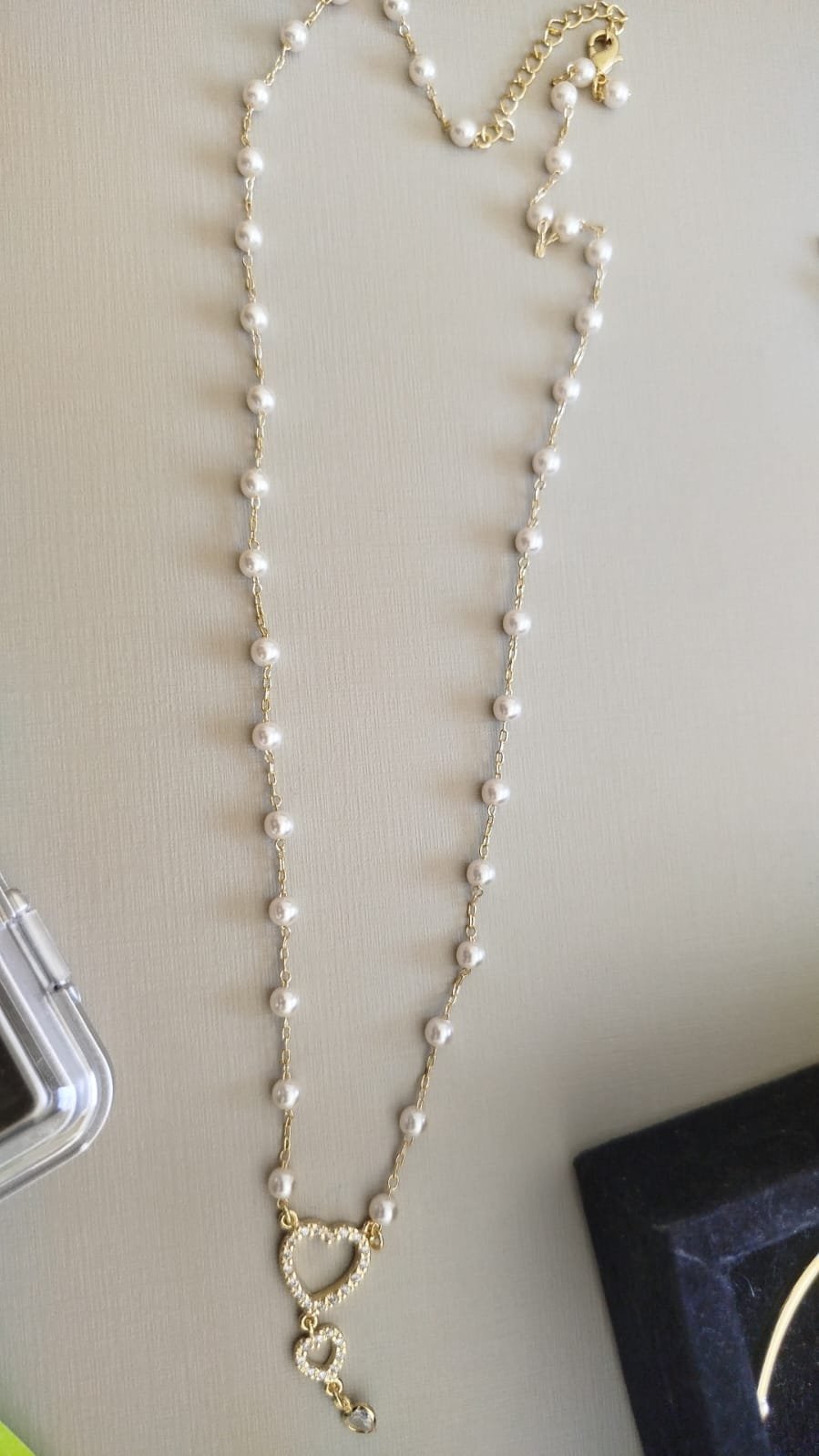 Gar. O. perola coração vazado zirc.crav.