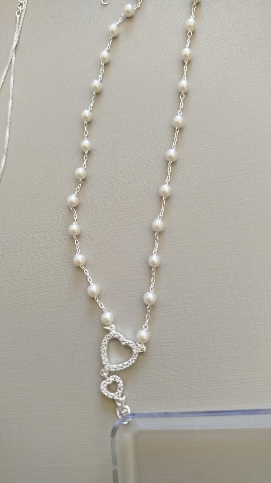 Gar. P. perola coração vazado zirc.crav.