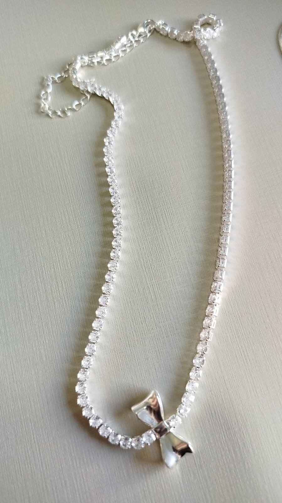 Gar. P. riviera cristal laço