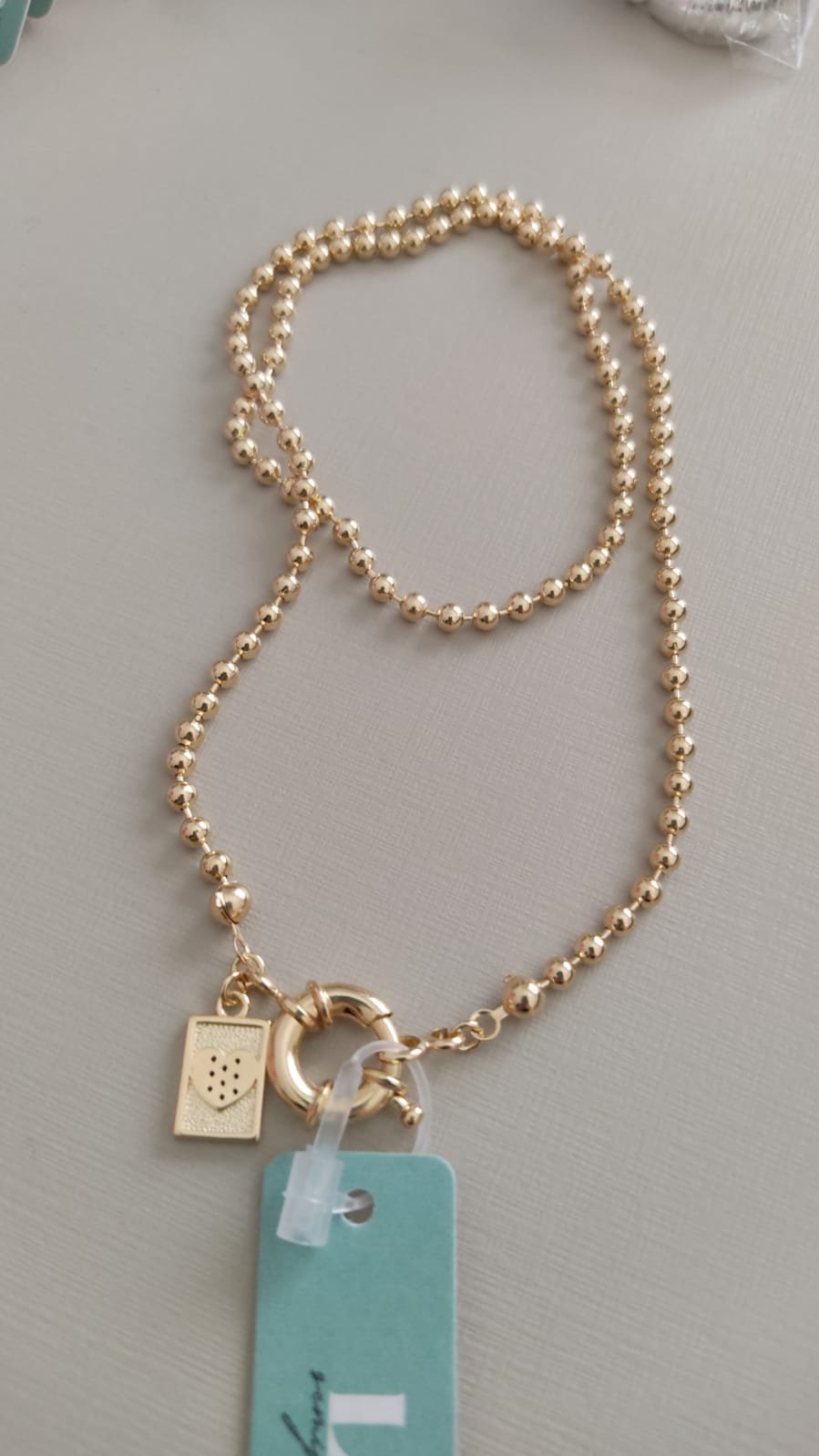 Gar. O bolinha fecho noia com ping. plaquinha coração zirc.