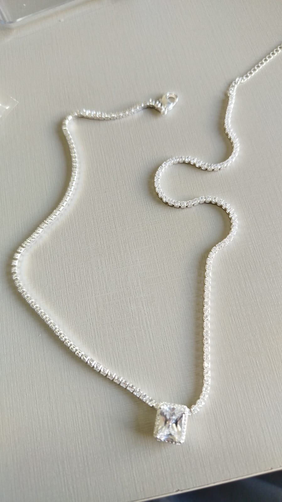 C.P riviera com ping. cristal retangular com zirc. crav.